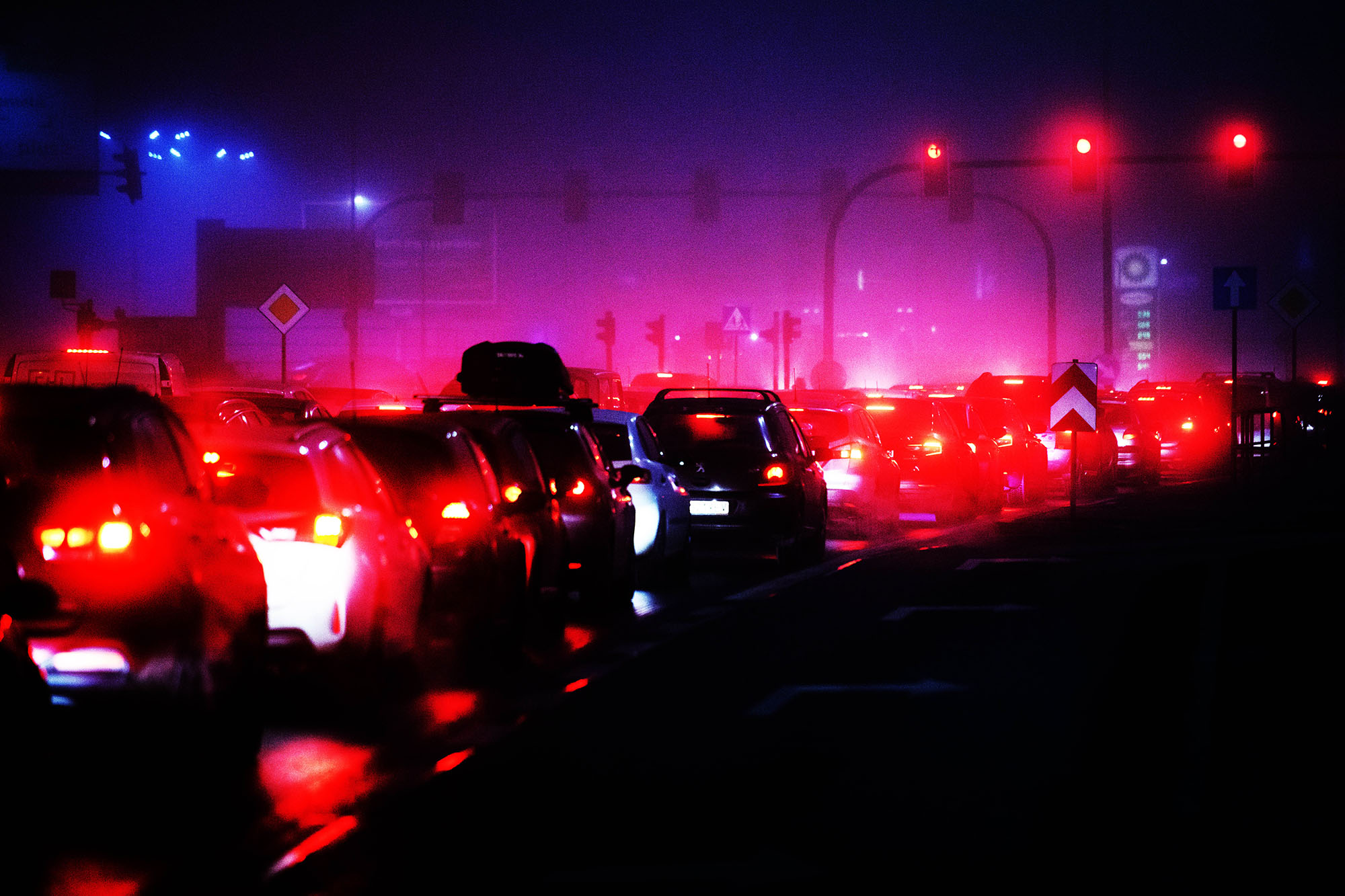 Traffic jam at night with bright red lights